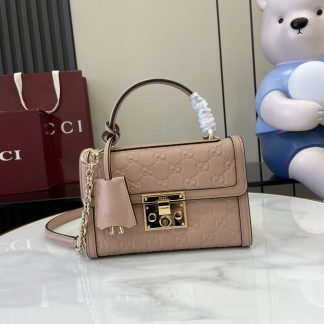 Bolso de mano Gucci con candado y logotipo GG en relieve